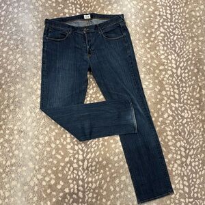 Perfectly worn men’s dark blue jeans.  Size 38